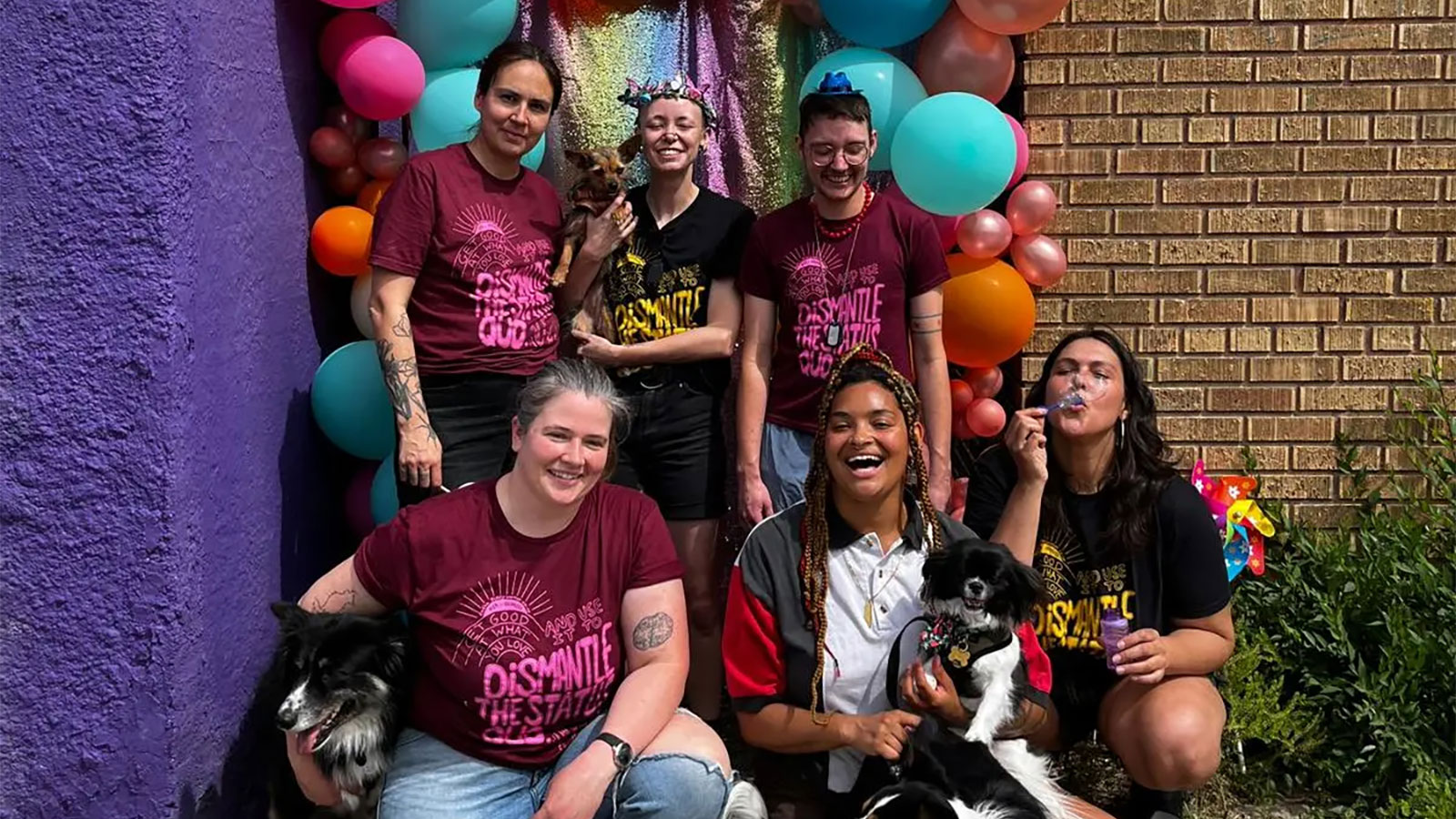 Eadha smiling with team outside